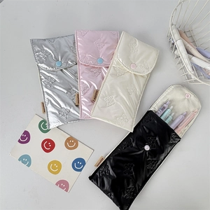 Bow embroidered glossy pencil case set in silver, pink, cream, and black colors