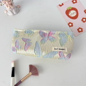Macro view of French jacquard texture with colorful 3D butterfly embroidery detail