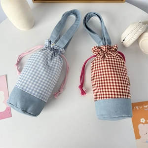 Detail showing blue and red checkered water bottle bags with drawstring and handle