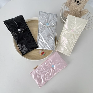 Quilted butterfly pattern storage pouches in black silver cream and pink colors