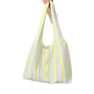 Colorful vertical striped rainbow tote bag in crinkle seersucker with stylish top handle