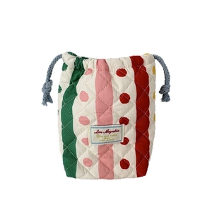 Quilted cotton drawstring pouch with colorful stripes for instant camera protection