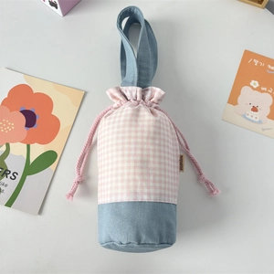 Detail of checkered water bottle carrier with drawstring closure and portable strap