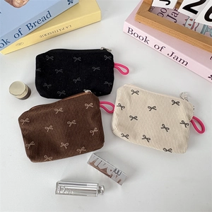Pochettes à monnaie en velours côtelé floral noir, marron et crème avec motifs nœuds