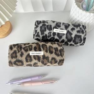 Close-up of leopard print plush pencil cases in brown and grey with May Rabbit labels