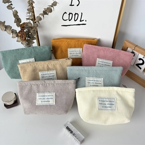 Detailed view of ribbed corduroy cosmetic bags in seven different Morandi colors