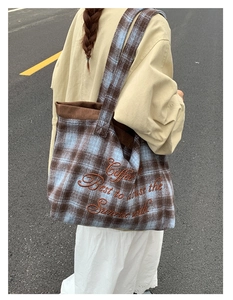 Detail of vintage plaid tote bag featuring coffee embroidery and brown corduroy trim detail