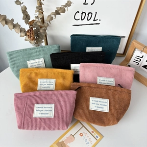 Corduroy makeup bags in multiple colors with zipper closure and soft striped texture