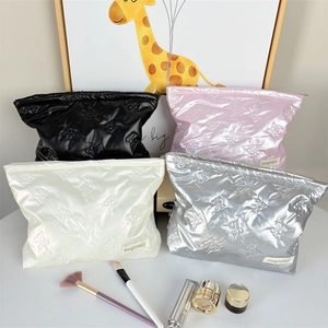 Chic quilted puffer makeup bags in multi-colors with elegant embossed bow pattern