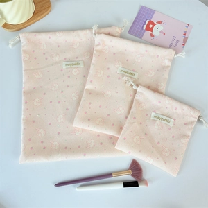Three-piece set of pink corduroy drawstring storage bags with cute rabbit floral patterns