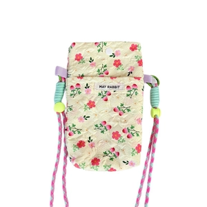 Quilted floral phone bag in cream with colorful flower patterns and woven shoulder strap