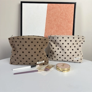 Vintage corduroy polka dot makeup bag in brown and beige colors with zipper closure