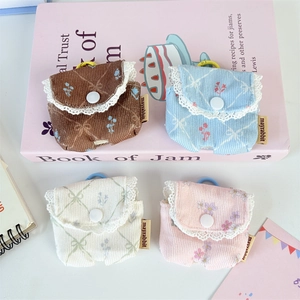 Floral corduroy earphone pouches with lace trim in brown, blue, white, and pink