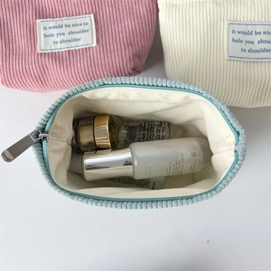 Close-up of corduroy makeup bag interior showing large storage capacity for skincare