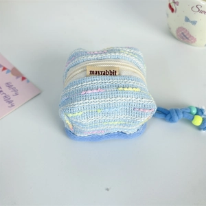 Close-up of colorful tweed earphone case with a blue beaded rope and zipper closure