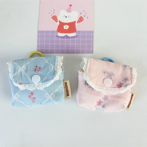 Corduroy floral earphone pouch with lace trim in blue and pink, button closure style
