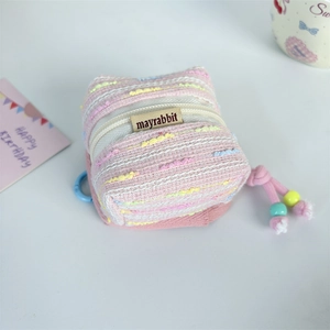 Pink woven mini earphone case with zipper, brand label and colorful bead decorations
