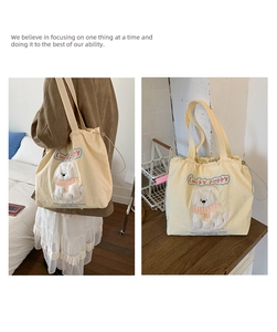 Detail of cute Lucky Puppy canvas tote with drawstring closure and dog embroidery