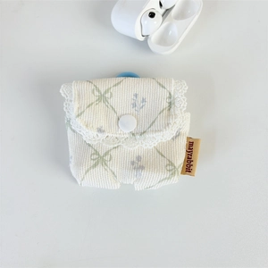 Detail of floral corduroy earphone case with green checkered pattern and lace trim