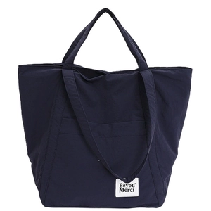 Minimalist navy blue nylon tote bag with double handles and Beyou Merci label