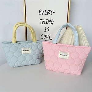 Quilted pastel tote bags with contrast handles and bubble texture in candy colors