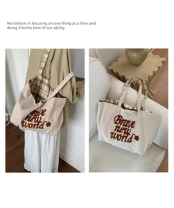 Detail of beige corduroy tote bag showing the plaid lining and textured embroidery