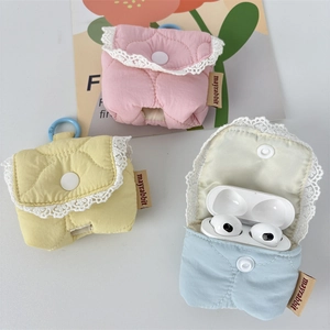 Pastel quilted wireless headphone cases with lace trim and snap closure in three colors