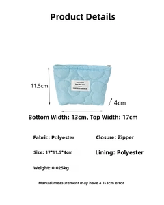 Quilted blue cosmetic bag with 17x11.5x4cm dimensions and polyester fabric details