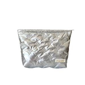 Chic silver metallic quilted makeup bag with bow pattern embossing and top zip closure