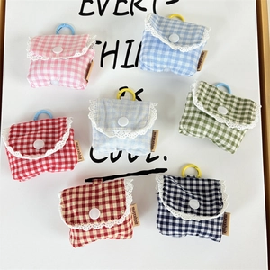 Group of floral plaid earphone cases with lace trim and plastic hooks in various colors