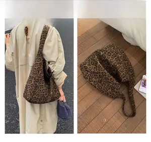 Matching display of a leopard print wool tote bag showing back view and flat lay