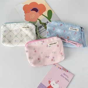 Set of three floral corduroy mini pouches in cream blue and pink for makeup and coins