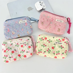 Cute printed mini canvas coin pouches in bear and strawberry patterns with quilted texture
