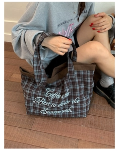 Detailed embroidery on a retro plaid tote bag with corduroy handles and large capacity