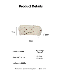 Detailed view showing the cotton fabric and 19x7x6cm dimensions of this striped heart pouch
