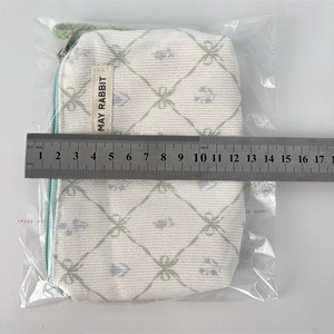 Top view of mini floral canvas pouch with measurement scale showing 13.5cm length