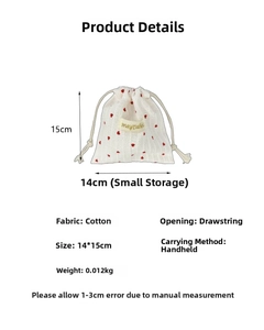 Detail view of cotton drawstring bag with red heart print showing 14x15cm size specs