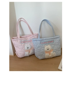 Quilted heart pattern tote bag featuring cute plush puppy patches in pink and blue