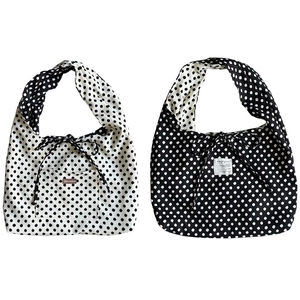 Minimalist canvas polka dot tote bags in black and white with ribbon bow closure