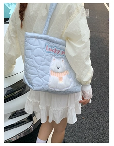 Quilted light blue heart-pattern tote bag with a cute plush puppy embroidery detail