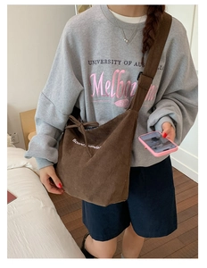 Brown corduroy shoulder bag featuring Bonne Journée print shown in lifestyle scene
