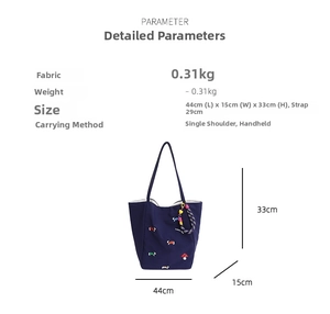 Detail showing dark blue canvas tote with mushroom embroidery and size specifications