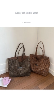 Detailed view of large leopard print tote bags in dark and light brown canvas patterns
