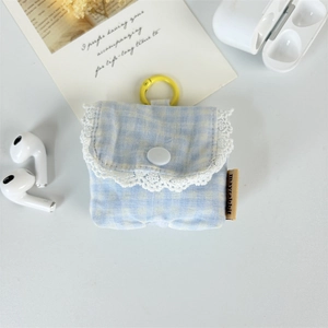 Detailed view of blue checkered earphone pouch with white lace edge and metal hook