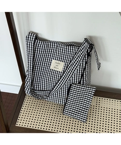 Detail showing high-quality black and white gingham canvas tote bag and matching coin purse