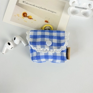 Detail of blue plaid floral earphone case with lace trim and hanging loop attachment