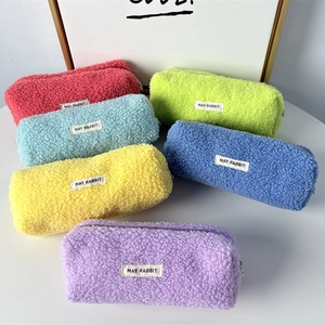 Close-up of soft teddy fleece pencil cases in multiple colors with zip closure
