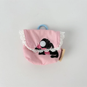 Detail of pink floral pouch with lace trim, cat illustration, and hanging snap buckle