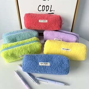 Close-up of colorful teddy fleece pencil cases with lamb velvet texture and zipper closure