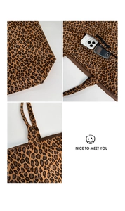 Detailed views of the spacious interior and base of this leopard print tote bag